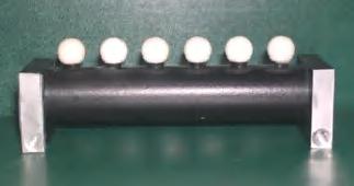 Fig. 1. Ball-bar with six ceramic spheres. The spheres have diameter of 10 mm and distance between spheres of 15 mm. Fig. 2.