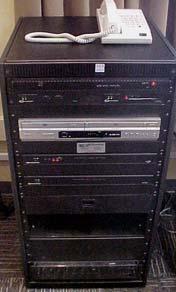 It houses the VCR/DVD Player as well as the controls for the sound system for the room.