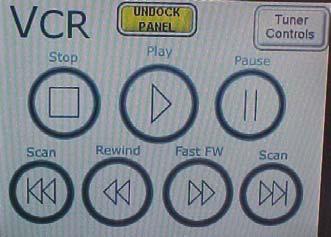 See picture at right. This button allows you to toggle back and forth between more DVD controls. Use these controls to navigate through DVD menus. Presenting from the VCR player 1.