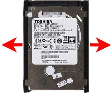 7. To remove the rubber rails from the hard drive, pull each rail off to disengage the adhesive that