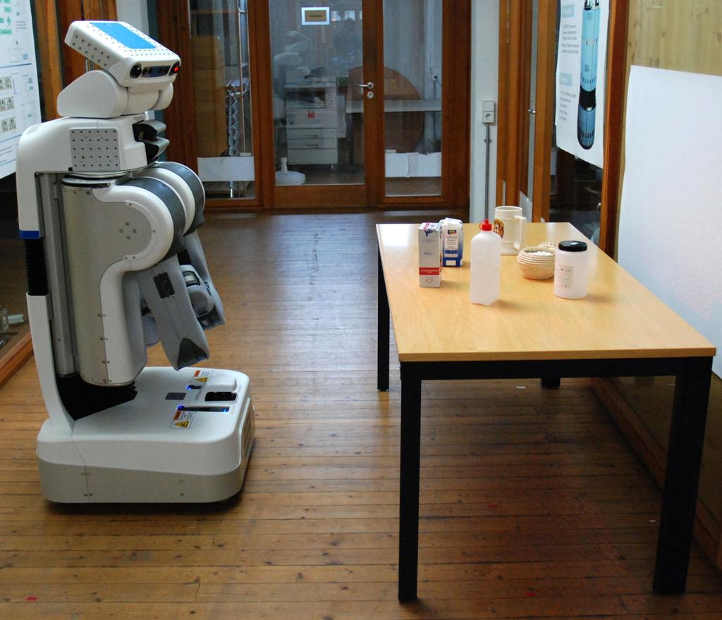 5.5 Evaluation 133 Figure 5.18: Experimental setup. A PR2 robot measures objects on a table using its stereo camera.