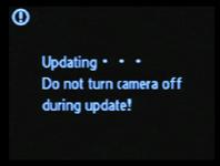 6 Turn the camera off and then on again. The message shown at right will be displayed while the camera completes the update.
