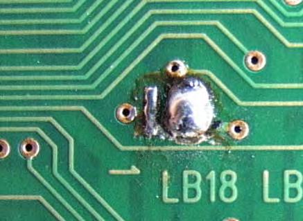 11-7: Soldering pads on soldering side of PCB "DSP01 Areas A and B where soldering pads LB1, LB2 and LB18 are located in, are marked in yellow in the depiction above.