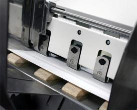 Loosen the locking screws located behind the Sheet Separators and raise the Separators, then tighten the locking screws to hold the Separators in