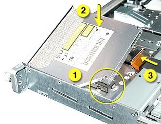 11. Align the corner of the replacement drive with the two guides in the chassis and press the drive down until you