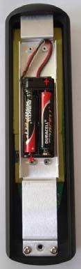 Fit 2 AA size batteries by pressing the flat end (-) against the spring and pressing the battery into the