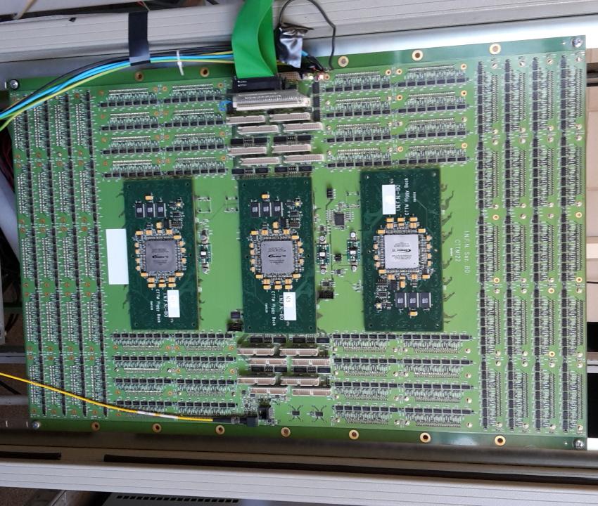 Figure 1: Front side of the CTTM board: the three FPGAs are visible. On the backside there are the LVDS connectors for the signals coming from the 72 LTMs. module.