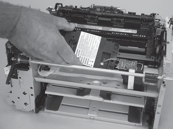 Carefully slide the laser/scanner assembly away from the main-motor PCA bracket and then disconnect one wire-harness connector