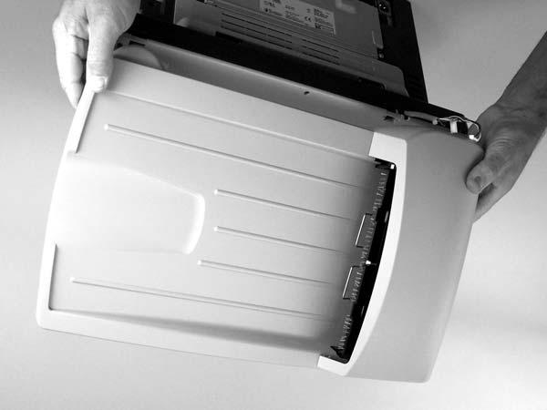 Raise the flatbed scanner lid until the hinges can clear the hinge posts on the scanner bed, and then remove the flatbed lid from the scanner assembly.