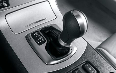To Shift Down: Pull the left-side paddle shifter towards you, or move the transmission selector lever to the (down) side. The transmission shifts to a lower range.