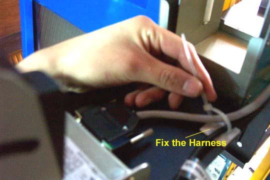 5. Slide the printer tray outside of the kiosk and tie the rest of the cables together so that they can t be damaged or interrupt the paper path. 6.