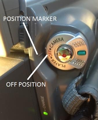 Turn your camcorder switch to PLAYER mode by pressing down on the green button (Figure 16) on the