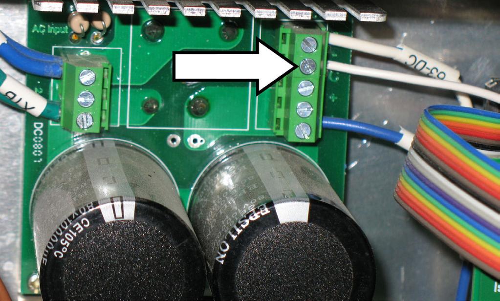 Tighten nuts finger tight. Connect the ribbon cable to the upper set of pins as shown in the photo.