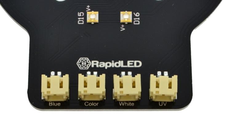 Next, on the opposite end, insert one driver jumper into each of the 2-pin sockets on the edge labeled with the colors Blue, Color, White, and UV.