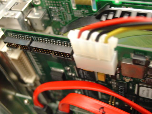 Install one of the single Disk Drive power connectors to the Corsica Board.