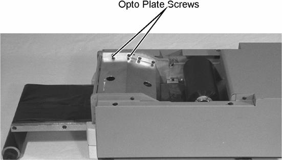 1. Loosen left T10 Torx opto plate screw located on the same side as print head cam. See Figure 15. Figure 15 2. Adjust the plate as required using tests four and five to move the cam.
