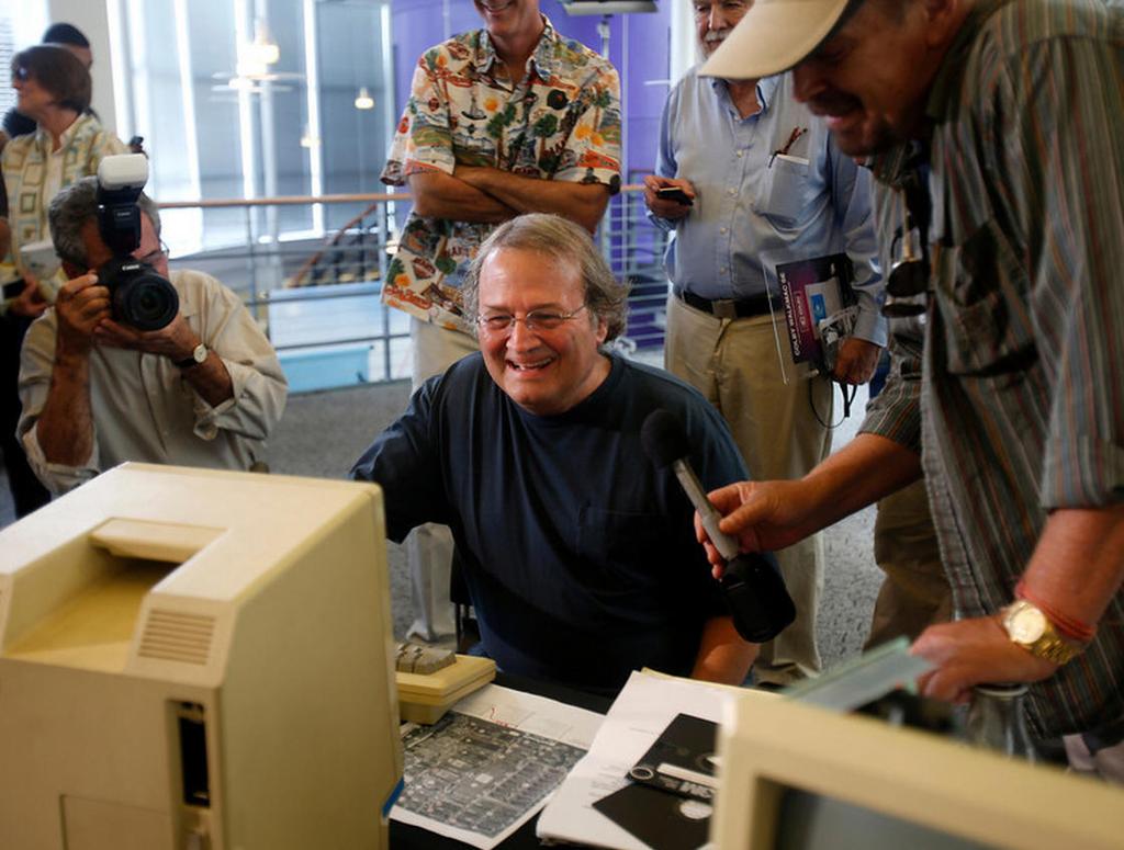 Early Apple employee Andy Hertzfeld checks out a prototype Macintosh 128K