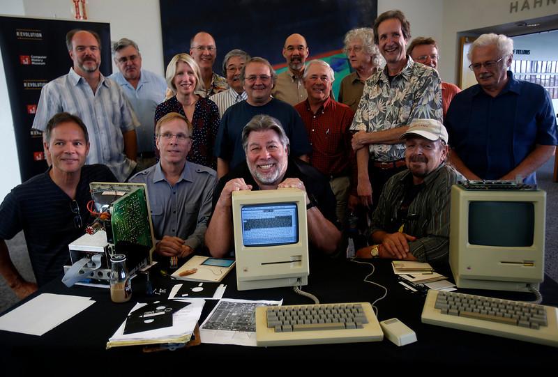 Some of Apple s earliest employees pose with a prototype Macintosh 128K with a Twiggy disk drive (owned by Gabreal Franklin) at the Computer History Museum in Mountain View, Calif. on Wednesday, Sept.