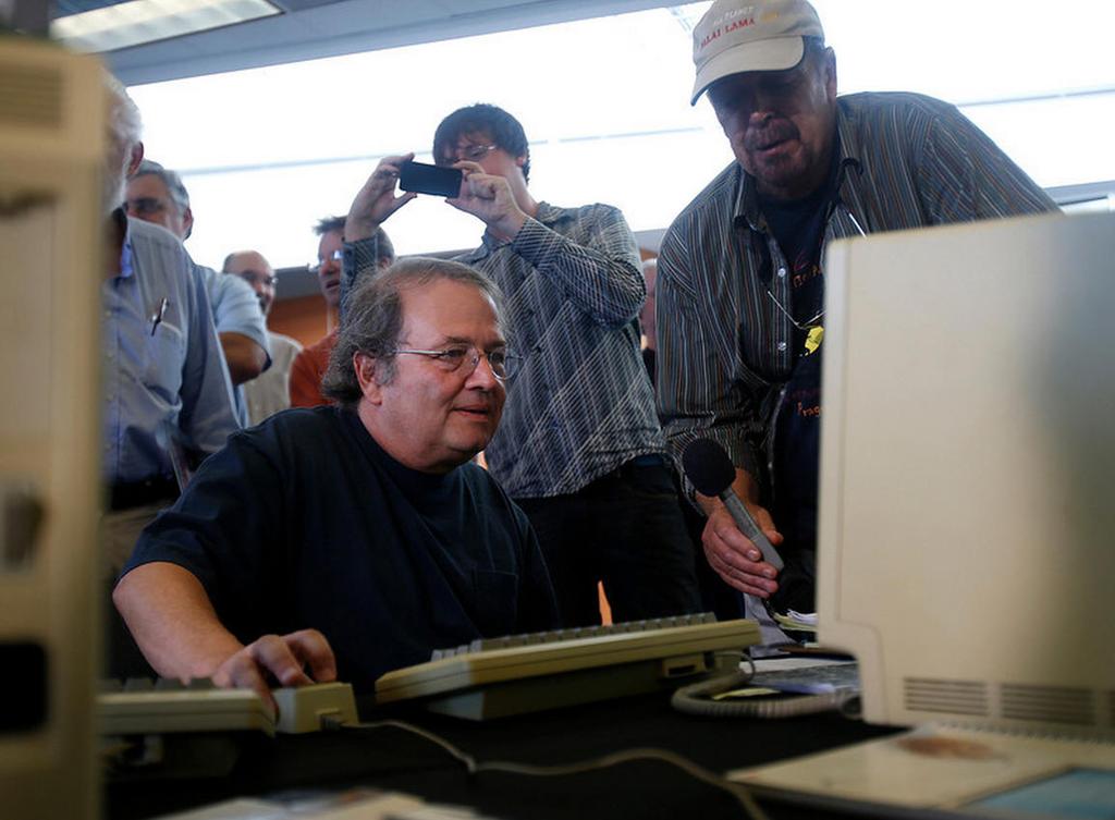 Early Apple employee Andy Hertzfeld checks out a prototype Macintosh 128K