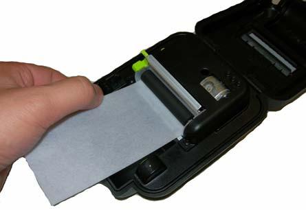 The printer will automatically feed the cleaning card, the card will feed under the roller and then exit the top of