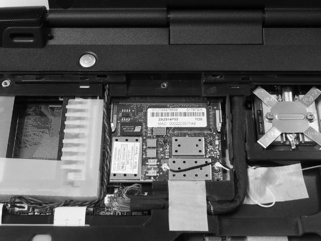 Remove one M2x4 security torx screw securing the mini PCI cover and lift out the cover. 2.