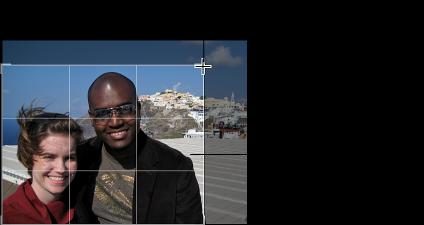 As you drag, a grid appears over the photo to help you compose the crop.