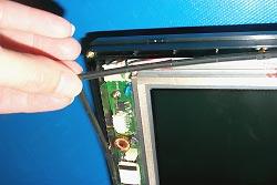 9. Place the touchscreen on top of the display unit. Important: The rubber gasket that fits along the rim of the unit seals out the moisture. 10.