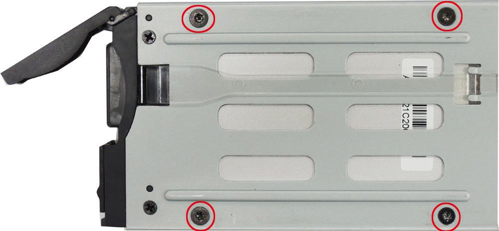To remove the storage device tray, insert a hex-type screwdriver in the appropriate slot, rotate it to the left, and then move the lock towards the left so that the spring-loaded latch can be used to