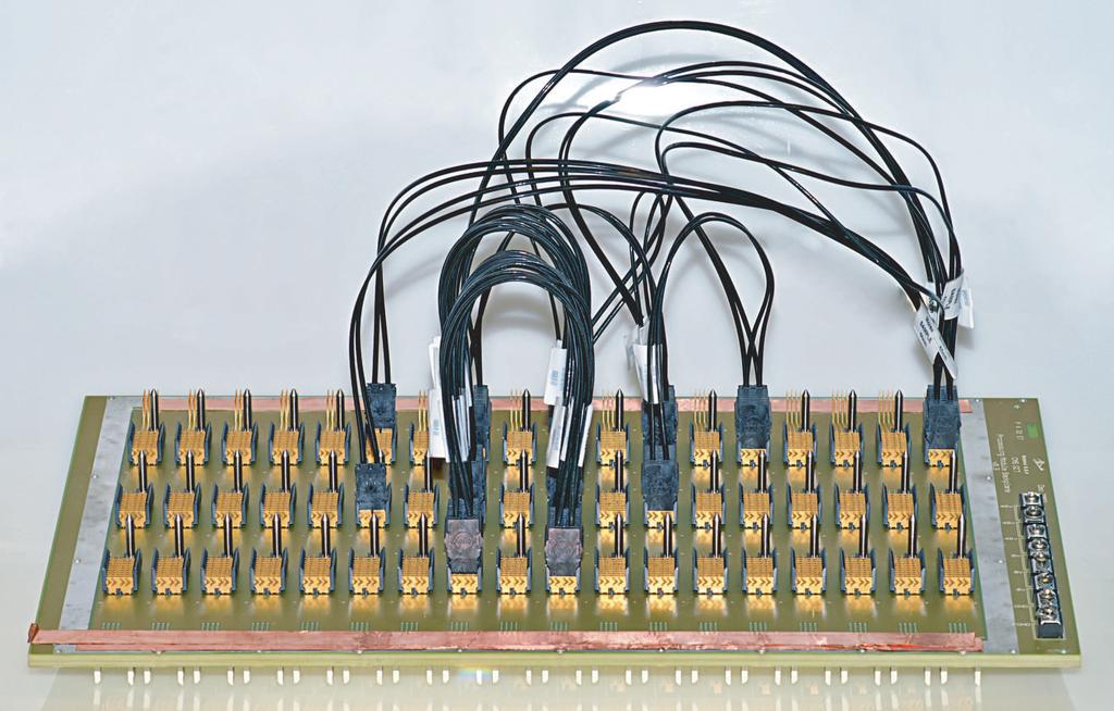 Figure 4: A cable backplane assembled for tests of prototype TPMs. Figure 5: A mockup of the final cable backplane layout, including all connections required for the jet and energy processing.