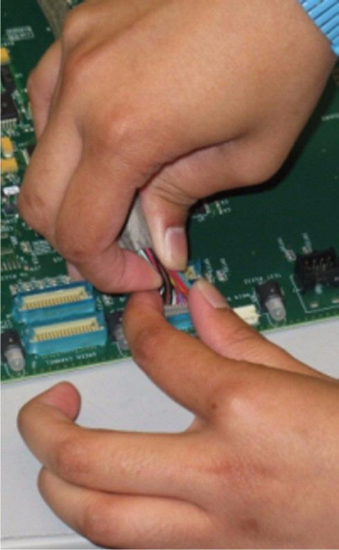 When disconnecting LVDS harnesses in these units, do the following: a. Spread the retention clips of the connector holder outward using your thumb and index finger. (Figure 6) CAUTION!