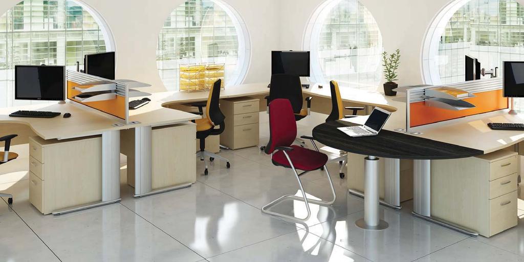 Symmetrical Desking Symmetrical desks offer the user additional working space with ergonomic benfits. Shown with optional acrylic dividing screens and meeting extension.