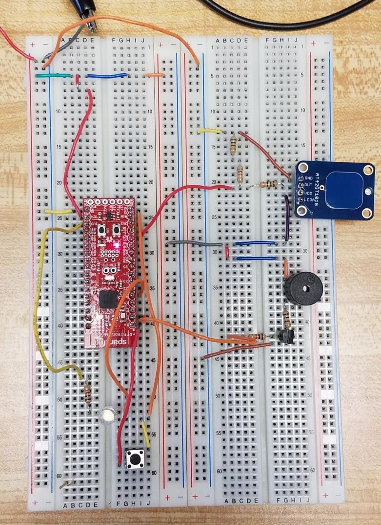 Figure 3.13: Breadboarded prototype circuit using SparkFun s nrf52 breakout board. The breakout board was powered using 3.0 V from the power supply to imitate a 3.0 V coin cell.