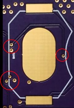 Figure 4.10: Incorrectly placed signal and VCC vias in coin cell battery area which would lead to multiple shorts.