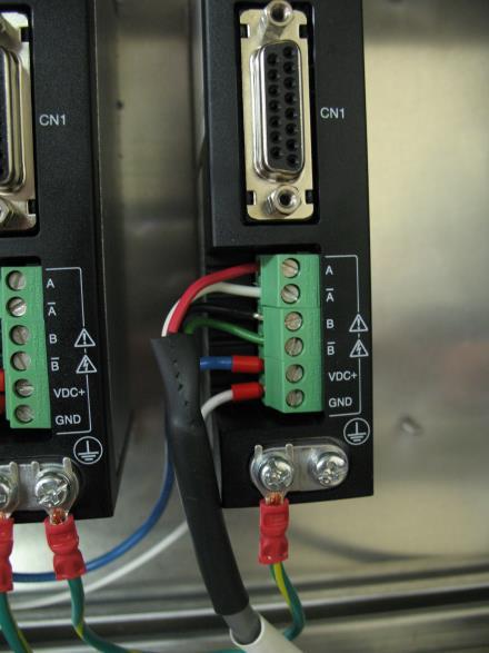 Open the Roxtec wire management system, on the right side of the control box, and route the motor cables to the drivers.