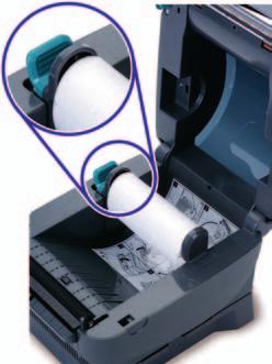 Move the left media hanger to the side. 3. Position the media roll so that the printing surface faces up as it exits the printer.