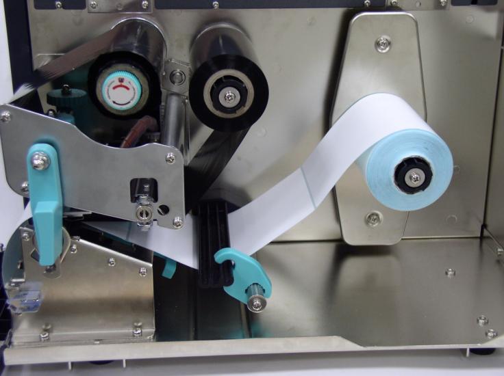 Ribbon Rewind Spindle Ribbon Supply Spindle Label Supply Roll Label Label Guide Figure 8. Ribbon & label installation path 3.