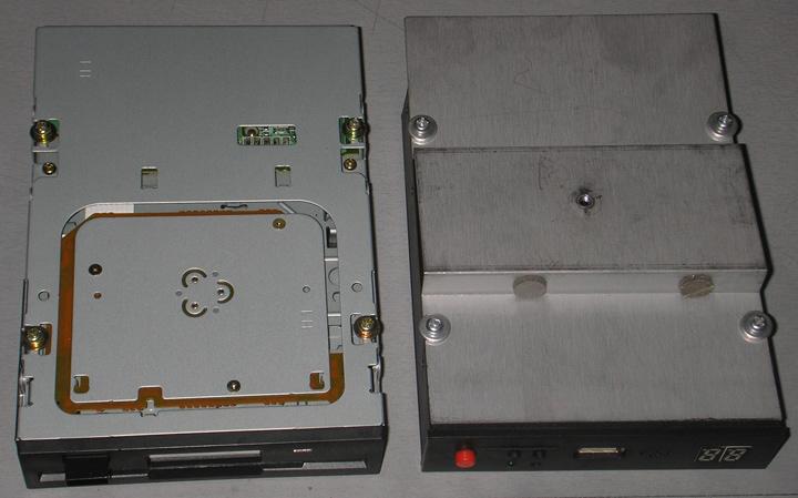 drive. Place the removed screws back in the floppy drive (not used).
