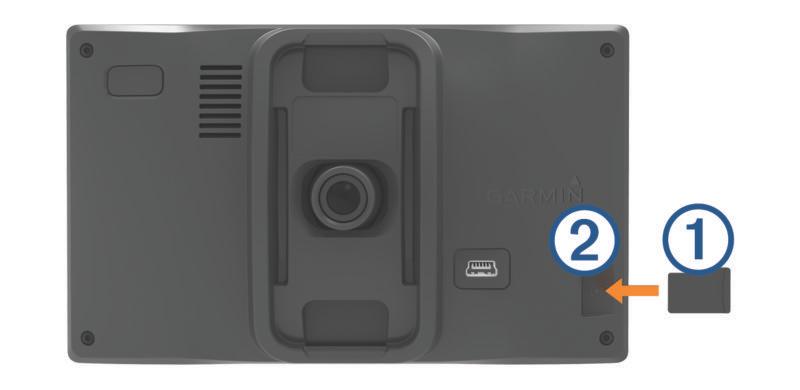 Installing the Dash Camera Memory Card Before the device can record video from the integrated dash camera, you must install a camera memory card.