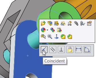 300) Hold the Ctrl key down. 301) Click the long cylindrical face of the AXLE. 302) Release the Ctrl key. The Mate pop-up menu is displayed. 303) Click Concentric from the Mate pop-up menu.
