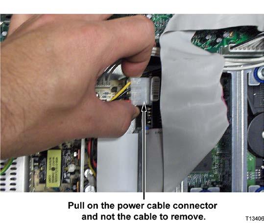 Replace the Hard Drive on an Explorer 8000 or 8010 that Requires a Retrofit Bracket 3 Carefully disconnect the power cable from the hard drive.