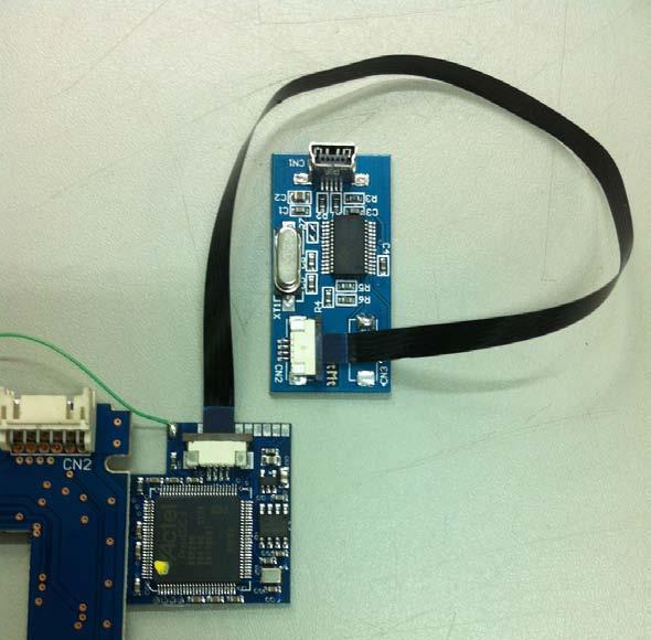 After assembling the Add-On and PCB together, you need to connect the Matrix Freedom USB Programmer using its flat cable to the connector available on the Add-On.