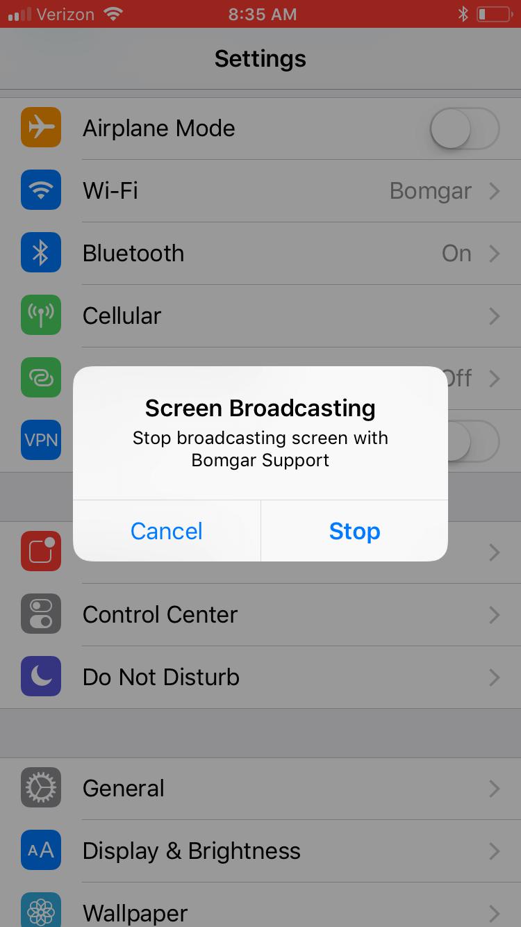 Whenever the user wishes to end their screen broadcast, they tap the red bar and tap Stop on the Screen Broadcasting prompt.