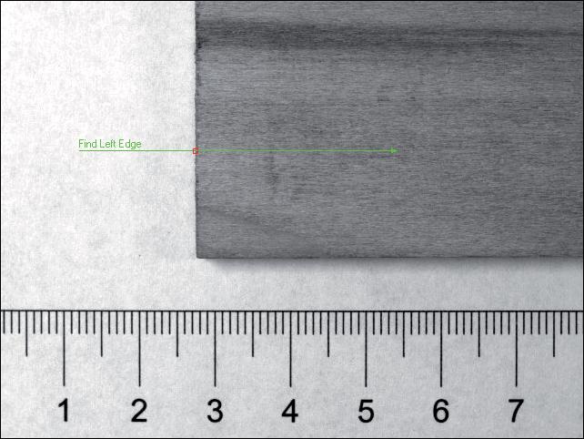 Chapter 5 Inspecting an Object that Spans Two Image Frames 4. Hold down the <Shift> key and draw a line across the left edge of the part going from left to right, as shown in Figure 5-6. 5. Click the Settings tab.