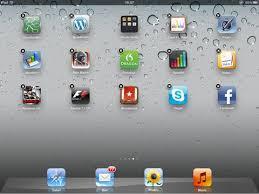 Organizing and Deleting Apps Hold your finger down until a black circle with an x appear and apps are jiggling. While that is happening apps can be deleted by touching the white circle with the X.