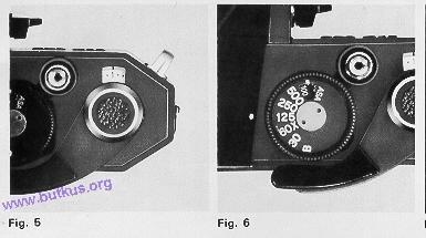 Wind film and press Shutter Release Button (D) each time until a set of sprocket holes on the film engage Sprocket Teeth (Y). Close camera back and snap it shut.