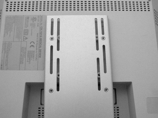 Attaching the Keypad Mounting Bracket to a 15'' Display CAUTION: To prevent damage to the display, the correct length M4 screw must be used to fasten the Mounting Plate to the display