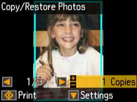 Press the + or button to select one or more copies of the photo (up to 99). 11.