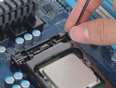 ) Step 3: Align the CPU pin one marking (triangle) with the pin one corner of the CPU socket (or you may