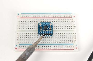 It will be easier to solder if you insert it into a breadboard - long pins down.