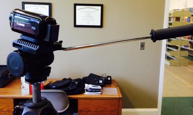 Use the extension handle to pan and tilt as you are filming. Remember to use smooth motions.